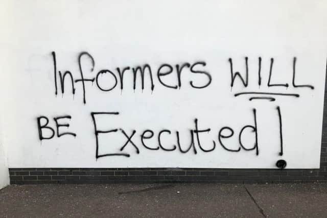 'Informers will be executed!' appeared on a wall only a few hundred metres away from where 29 year-old journalist Lyra McKee was shot and killed by a masked gunman.