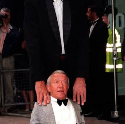 Peter Mayhew, who has died at the age of 74, and Kenny Baker, who played R2D2, at the Royal Film Performance of Star Wars: Episode 1 The Phantom Menace at the Odeon Leicester Square