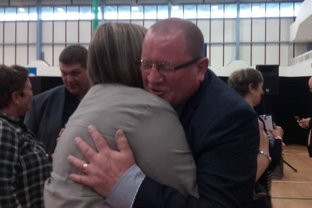 Alliance's Neil Kelly pictured hugging a supporter in the Valley Leisure Centre on 03-05-19, after securing a massive victory in Antrim.
