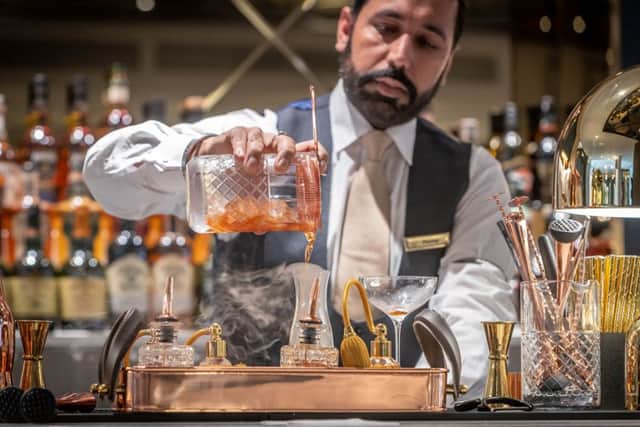 A barman creates a special cocktail at the bar of The Morgan Hotel in Dublin