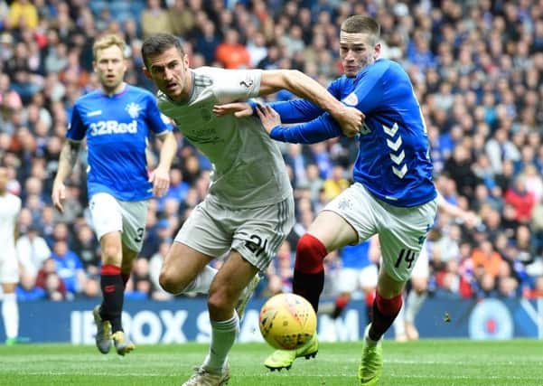 Aberdeen's Dominic Ball and Rangers Ryan Kent (right) in action at Ibrox