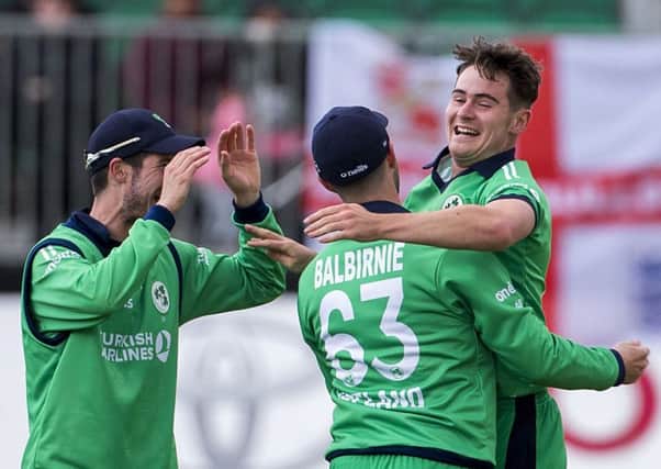 Irelands Joshua Little (right) celebrates with team mates George Dockrell (left) and Andrew Balbirnie  after bowling England captain Eoin Morgan