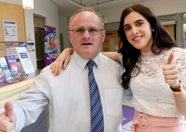Barry McElduff  celebrates with his daughter, Niamh, during the local elections count at Omagh Leisure Centre after he secured a seat on the Fermanagh and Omagh District Council
