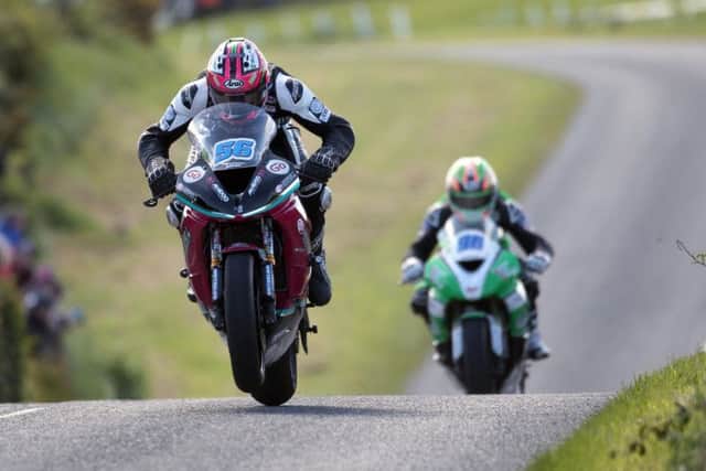 McAdoo Racing's Adam McLean leads Derek McGee in the Supersport race at the Tandragee 100 in Co. Armagh on Saturday. Picture: Stephen Davison/Pacemaker Press.