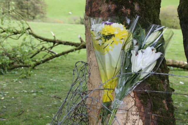 Flowers left at the scene of the collision