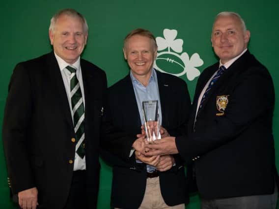 Malone's Stuart Duncan (right) receives the Spirit Club of the Year at Tuesday nights IRFU All Ireland League awards from Ireland head coach Joe Schmidt and IRFU president, Ian McIlwrath