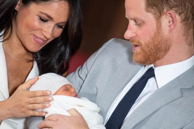 Prince Harry and Meghan Markle with their newborn son, Archie Harrison Mountbatten-Windsor.