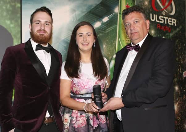 Paddy Elliott and Orla McMahon of Queen's University Rugby receives the Club of the Year Award sponsored by Kukri Sports from Terry Jackson, during the Heineken Ulster Rugby Awards held at the Crowne Plaza Hotel