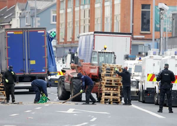 The PSNI oversaw the removal of the Cluan Place bonfire in east Belfast by contractors last summer