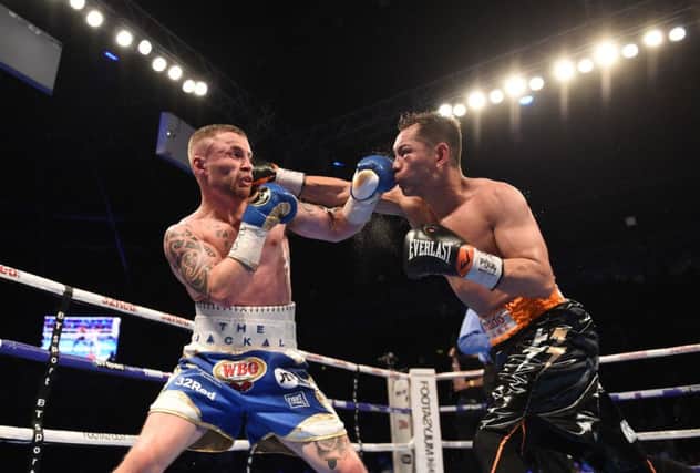 Nonito Donaire (right) in action with Carl Frampton