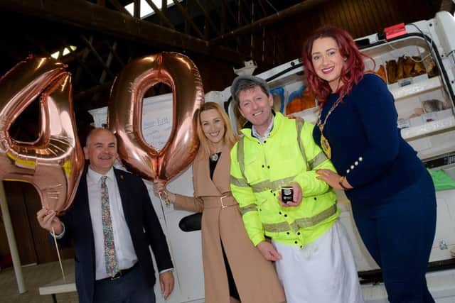 Mid and East Antrim Council representatives Stephen Daye, head of parks and open space, Claire Duddy, development manager, and Mayor Lindsay Millar congratulate Gerry McNabb on his 40 years at the weekly markets in Ballymena and Larne.