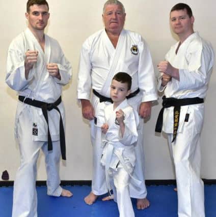 Pacemaker Press 11/05/19
Karate teacher Oliver Brunton aged 78 pictured with his sons Oliver  Jnr (left) and James (right) and Grandson Oisin, at  his dojo at College Street, Belfast, 
Pic Colm Lenaghan/Pacemaker