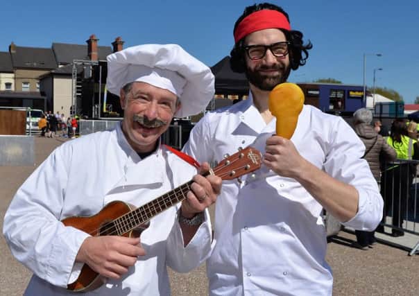 The Singing Chefs entertaining in the market yard. INLT 18-007-PSB