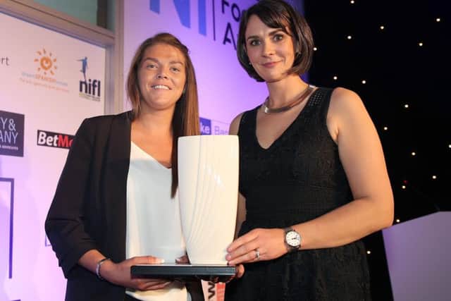 Electric Ireland's Anne Smyth presents the award to Billie Simpson from Cliftonville