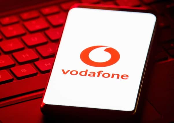 Vodafone swung deeply into the red over the year to March 31, against profits of £2.8 billion a year earlier