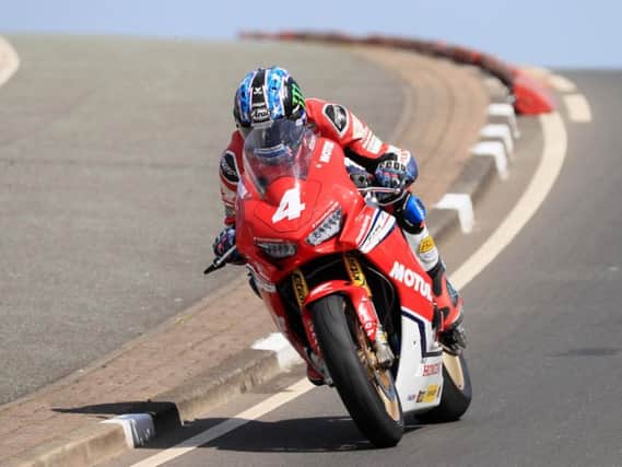 Honda Racing's Ian Hutchinson in action on the Honda Racing Superstock machine in practice at the North West 200 on Tuesday.