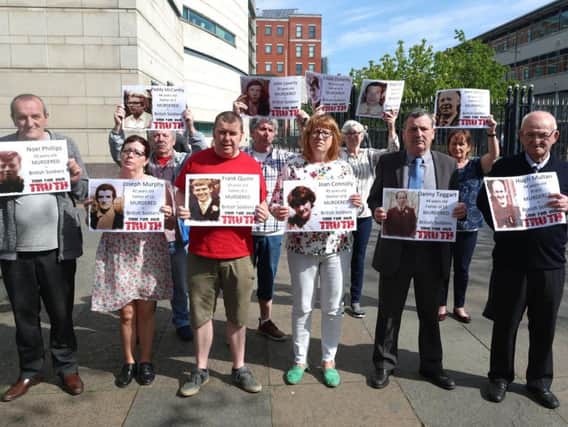 Families of the 6 people who died on the 9th of August 1971, during the first day of the Ballymurphy Massacre hold images of those who died outside Laganside Court in Belfast as the inquest continues into the series of incidents between 9 and 11 August 1971, in which the 1st Battalion, Parachute Regiment killed eleven civilians in Ballymurphy, Belfast