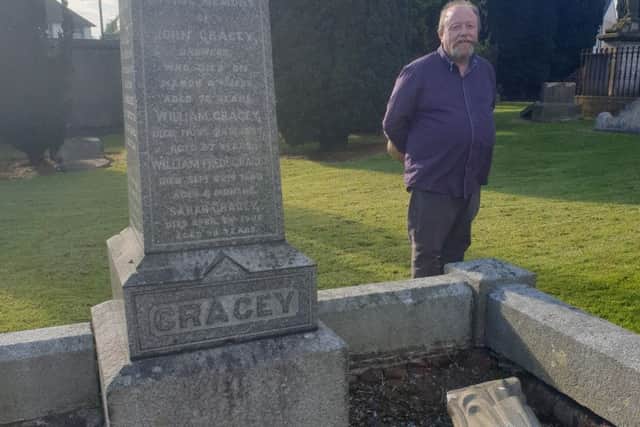Jim Conway of Friends of Shankill Graveyard beside yet another historic headstone which was vandalised recently