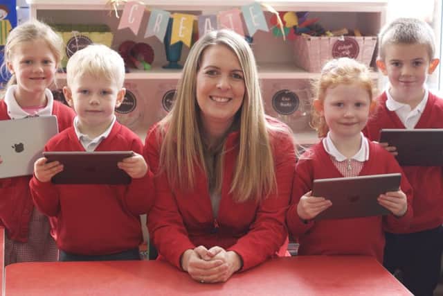 Karen Irwin encouraging pupils to explore the use of technology.