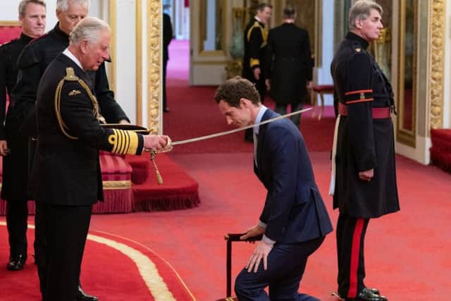 Sir Andy Murray receives his knighthood from Prince Charles