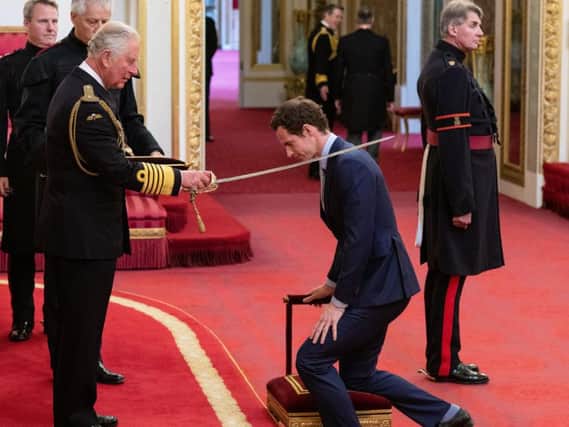 Sir Andy Murray receives his knighthood from Prince Charles