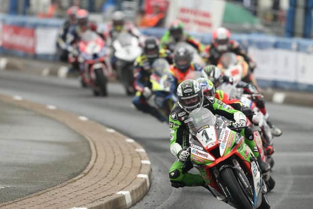 Glenn Irwin leads the Superbike pack at the North West 200 on his Kawasaki.