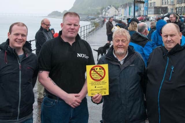 (From left) Gordon Lyons, MLA, Andy Glenn, of the No to Cloghan Point Campaign,  Cllr Robert Logan and Cllr. Gregg McKeen joined protestors in Whitehead. Pic by Rachel Louise Photography.