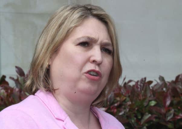 Northern Ireland Secretary Karen Bradley has been accused of using delaying tactics to stall legislation to compensate victims of institutional abuse.