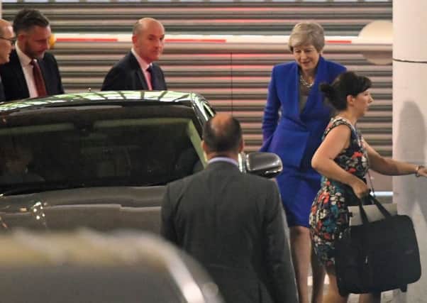 Prime Minister Theresa May leaves after making a speech in central London on her latest Brexit plans