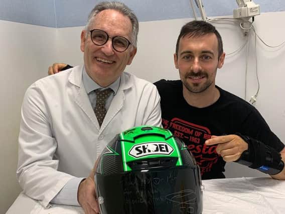 Eugene Laverty with Dr. Mir, who carried out the surgery on his fractured wrists in Barcelona.