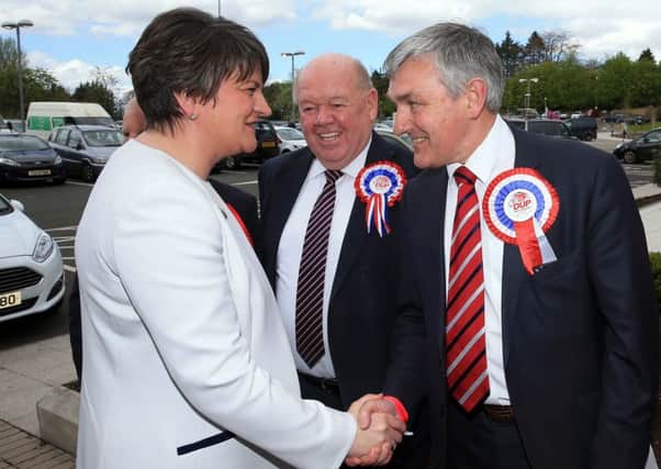 DUP MLA Thomas Buchanan (right) meeting party leader Arlene Foster at the 2016 Assembly election count