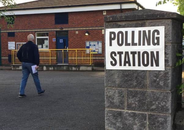 A voter at Belmont Primary School poling station, east Belfast