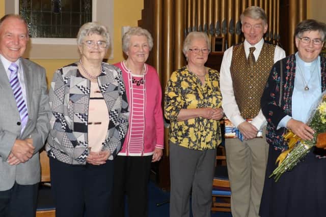 Making a presentation to mark the retirement of Rev. Farquhar are, from left, Arthur McQuitty, Mabel Bell, Elsa Robinson, Daphne Bashford, Maurice Farquhar and Rev Farquhar.