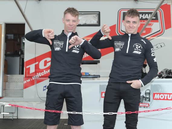 Sidecar stars Ben and Tom Birchall give a thumbs down after opening qualifying at the Isle of Man TT on Saturday was hit by the weather. Picture: Dave Kneen/Pacemaker Press.