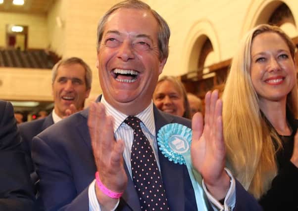 Brexit Party leader Nigel Farage (left) celebrates being elected after the European Parliamentary elections count at the Guildhall in Southampton. Photo: Andrew Matthews/PA Wire