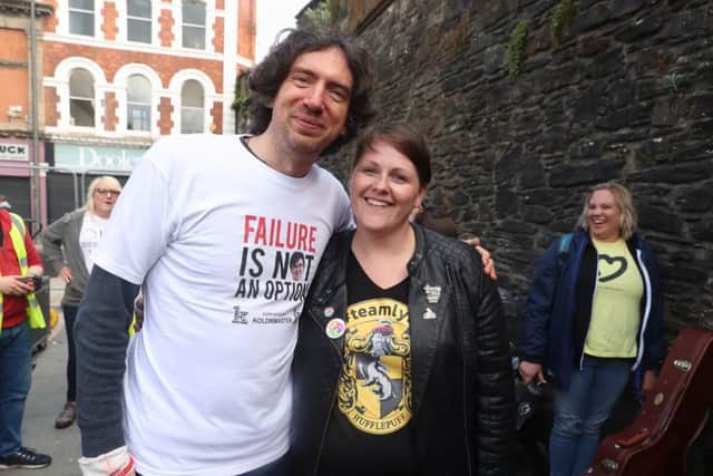 Lead singer of Snow Patrol Gary Lightbody poses with Sara Canning, partner of murdered journalist Lyra McKee, at the end of their  three-day peace walk from Belfast at the Guildhall in Derry, Northern Ireland. PRESS ASSOCIATION Photo. See PA story ULSTER Walk. Picture date: Monday May 27, 2019. Photo credit should read: Liam McBurney/PA Wire