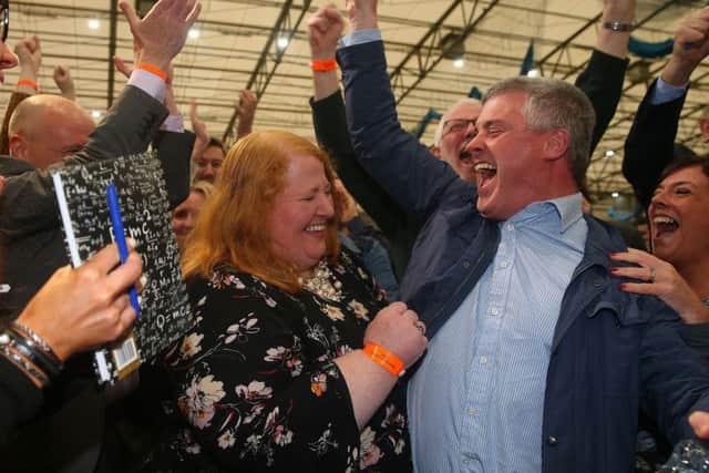 A jubilant Naomi Long celebrates with her husband Michael and Alliance members. Picture: Arthur Allison/Pacemaker