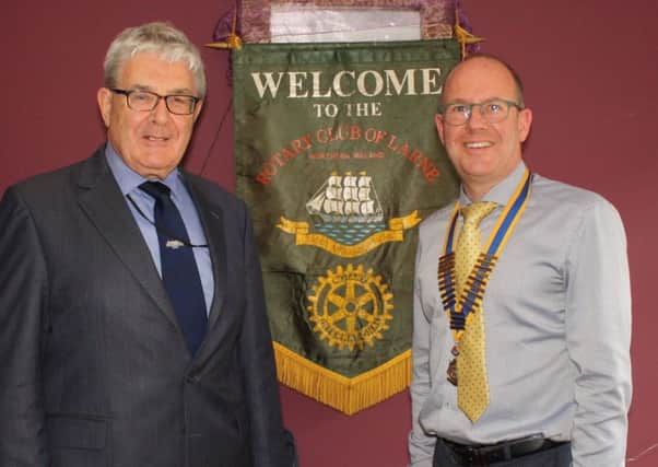 President Michael Thompson welcomes Charles Friel of the Railway Preservation Society of Ireland to the Rotary Club of Larne.