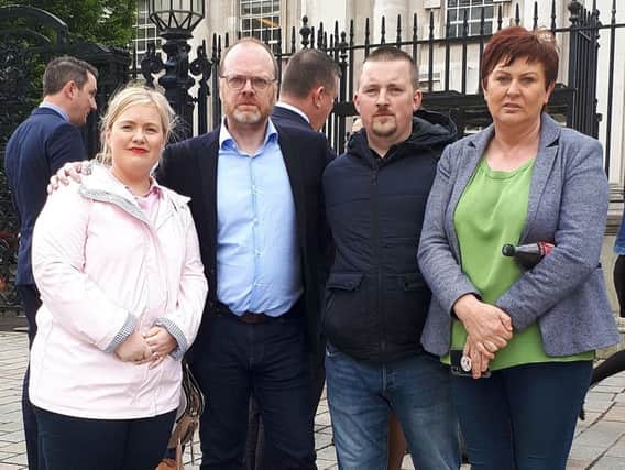 Trevor Birnie (second left) outside court with relatives of Loughinisland victims after the verdict