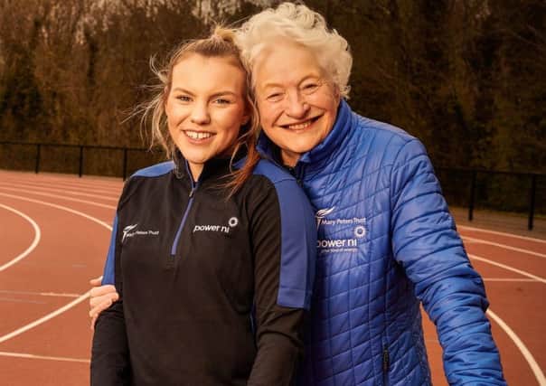 Triathlete Erin McConnell with Dame Mary Peters