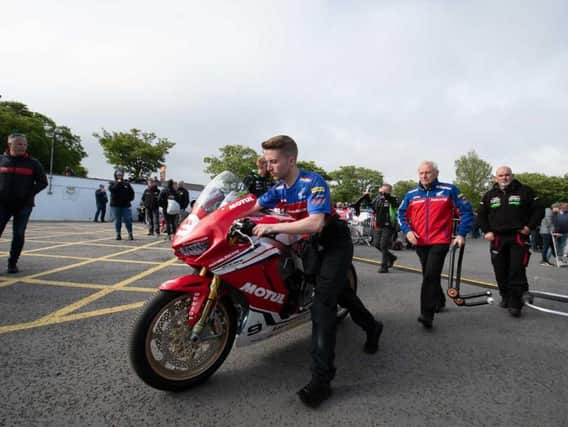 David Johnson's Honda Racing Superstock machine is wheeled away after Friday evening's Isle of Man TT qualifying session was cancelled due to poor weather. Picture: Tony Goldsmith.