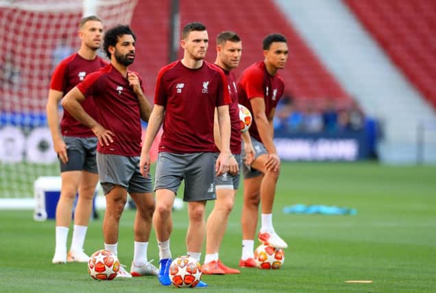 Liverpool's Andrew Robertson (centre) during a training session at the Estadio Metropolitano, Madrid
