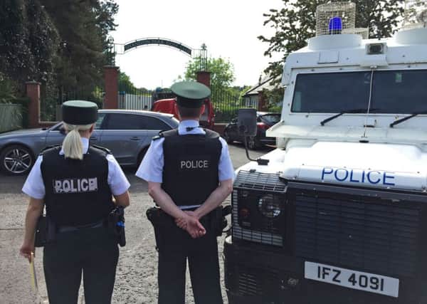 Police and army bomb disposal experts at Shandon Park Golf Club in east Belfast to examine a suspect device under a car in the car park on Saturday.