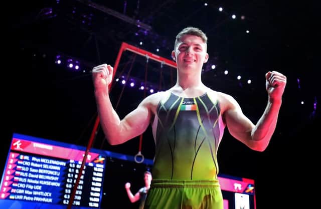 Ireland's Rhys McClenaghan celebrates winning gold on the pommel horse