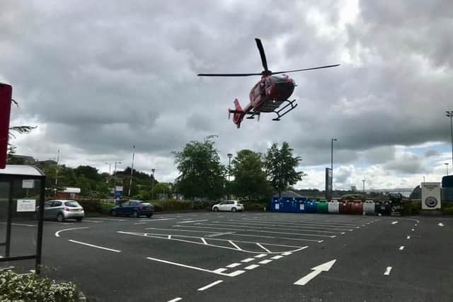 The Northern Ireland Air Ambulance pictured at the scene of the collision.