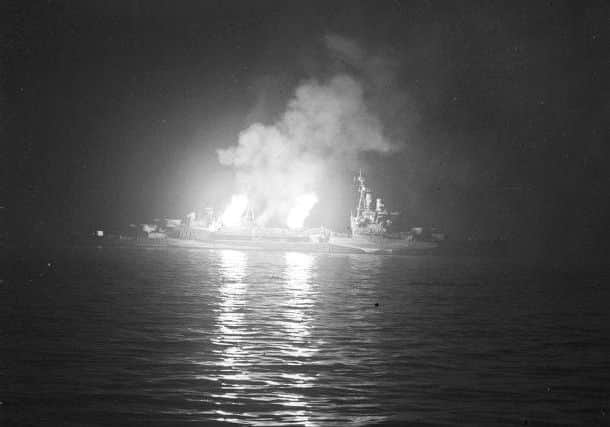 HMS Belfast bombards German positions in Normandy