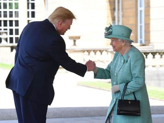 President of the United States of America, Donald Trump, shakes hand with Queen Elizabeth II at Buckingham Palace. (Photo: P.A.)