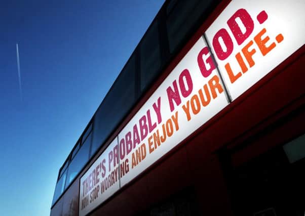 A bus displays an atheist message in Kensington Gardens, London, in 2013