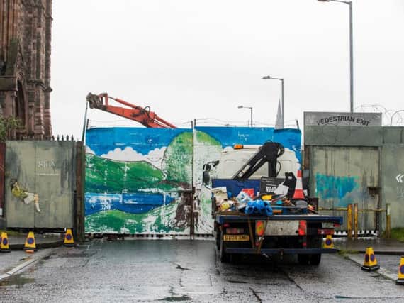 Work under way at the Townsend Street interface gates which form part of the peace wall in Belfast, where a 50-year-old security gate is being replaced with see-through barriers. Pic: Liam McBurney, PA Wire