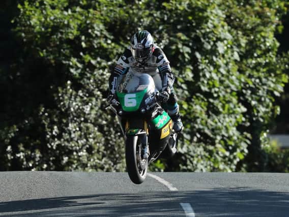 Michael Dunlop at Ballaugh Bridge on his way to his 19th Isle of Man TT win in the Lightweight race.